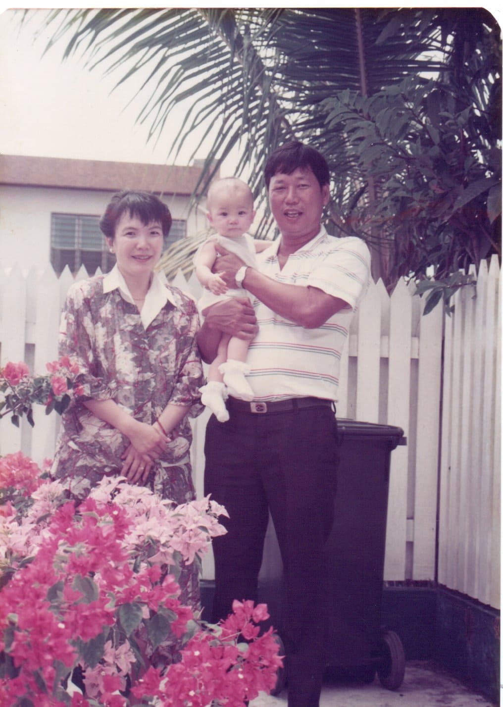 photo-of-parents-hugging-baby
