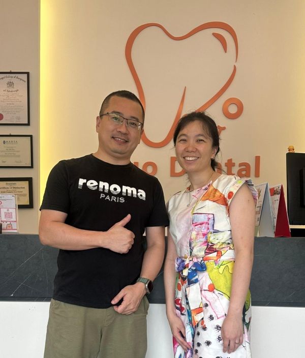 Dental implant happy patient in Kuo Dental