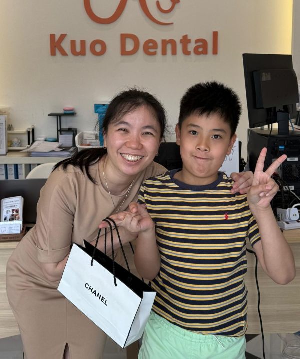 Dentist with happy client.